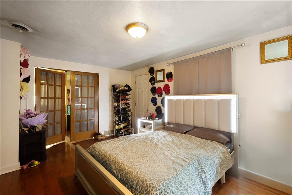 108 Pius Street Pittsburgh, PA 15203 - Photo 12 of 35 a bed room with a bed and a window