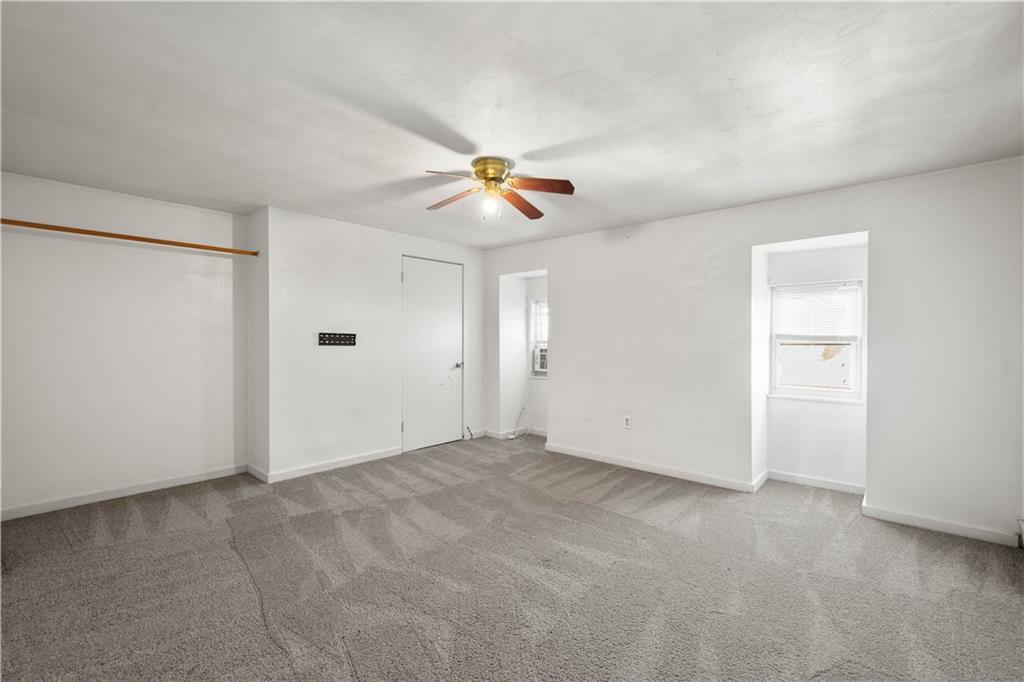 108 Pius Street Pittsburgh, PA 15203 - Photo 25 of 35 an empty room with closet and a ceiling fan