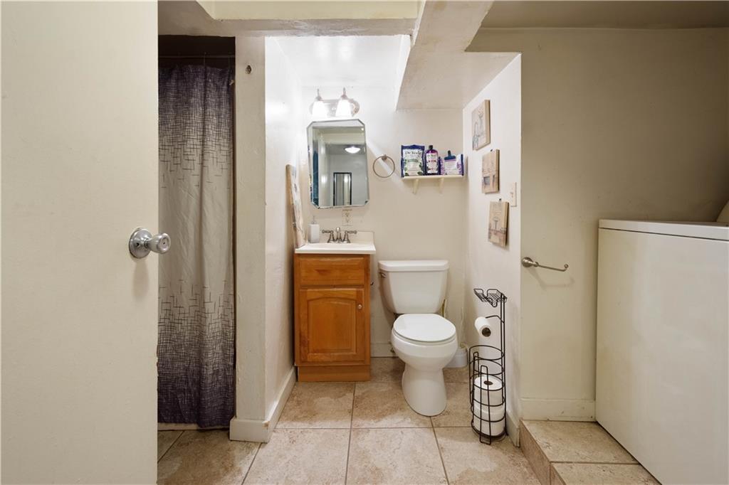 108 Pius Street Pittsburgh, PA 15203 - Photo 9 of 35 a bathroom with a toilet and a shower