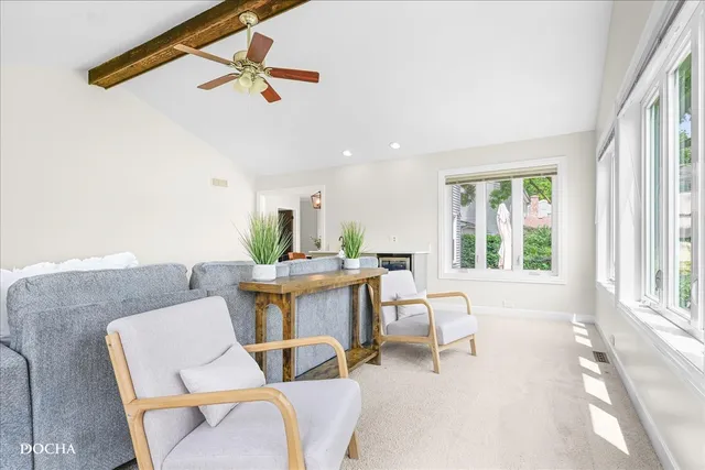 a kitchen with windows and a sink