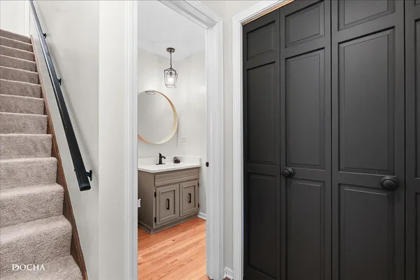 a bathroom with a sink toilet and a mirror