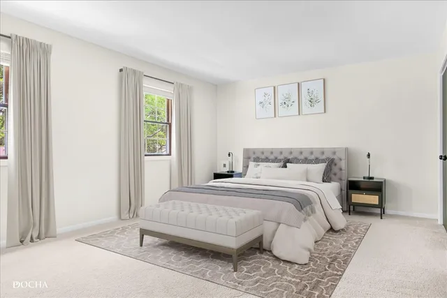 a bedroom with a bed and a couch