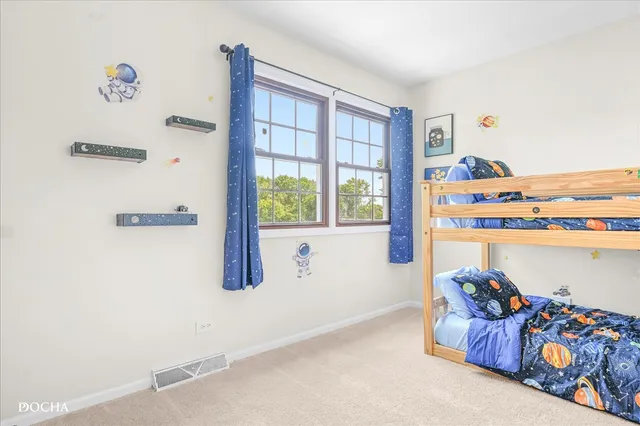 a bedroom with a bed and cabinets