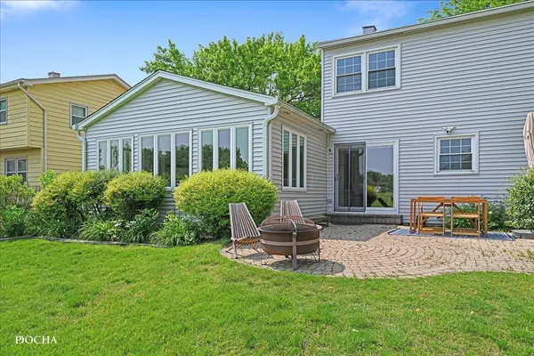 a view of a two chairs in a yard