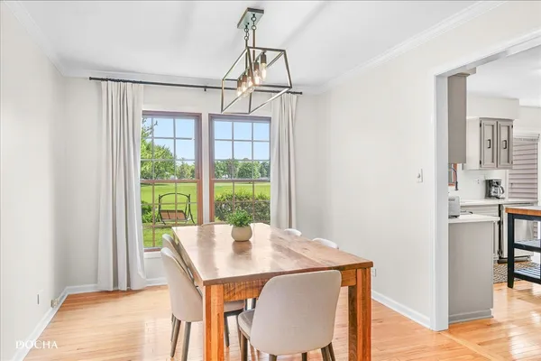 a kitchen with a sink refrigerator and cabinets