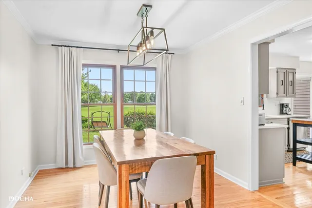 a kitchen with a sink refrigerator and cabinets