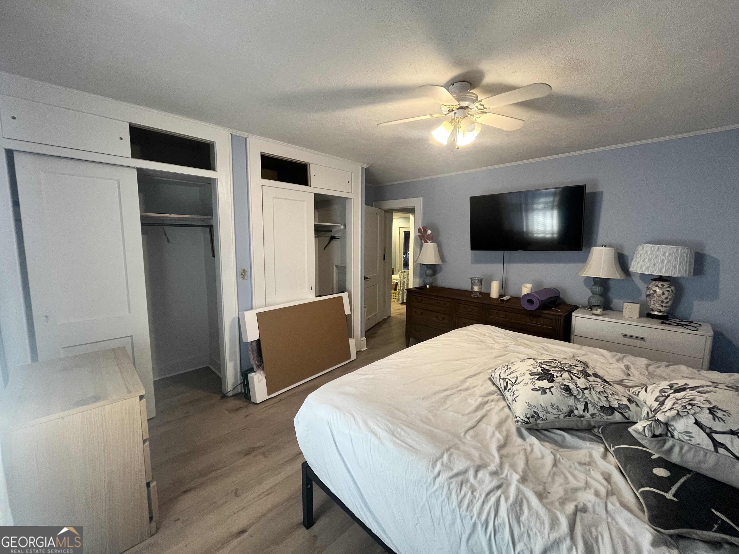 109 Schaefer Court Toccoa, GA 30577 - Photo 11 of 28 a bedroom with a bed and a flat tv screen on dresser