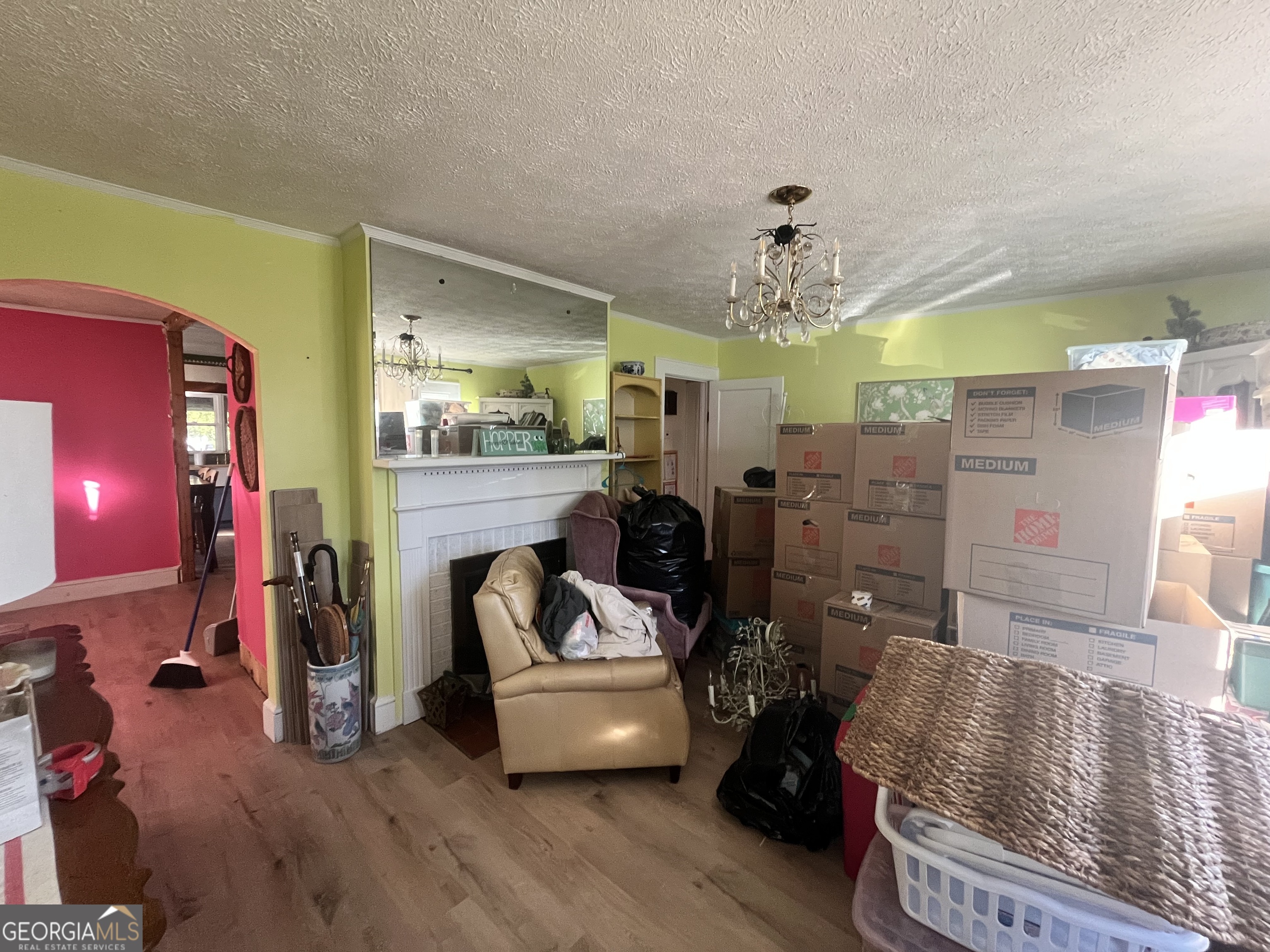 109 Schaefer Court Toccoa, GA 30577 - Photo 15 of 28 a living room with furniture and a chandelier