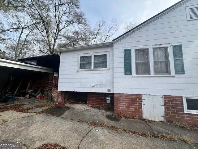 a front view of a house with parking space
