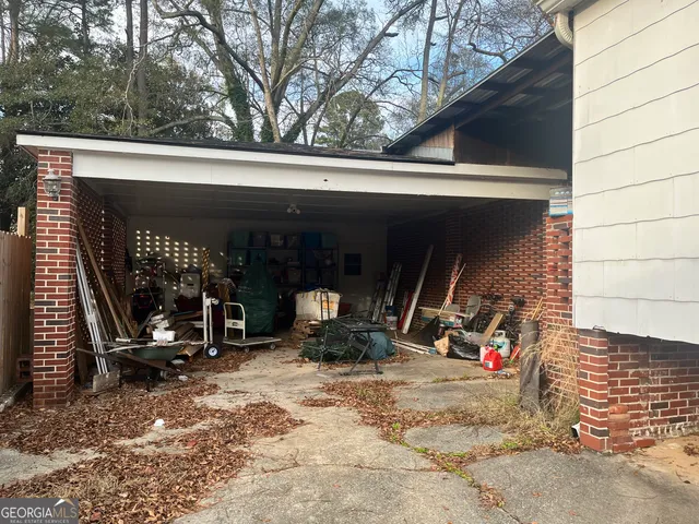 a view of a garage with parked cars