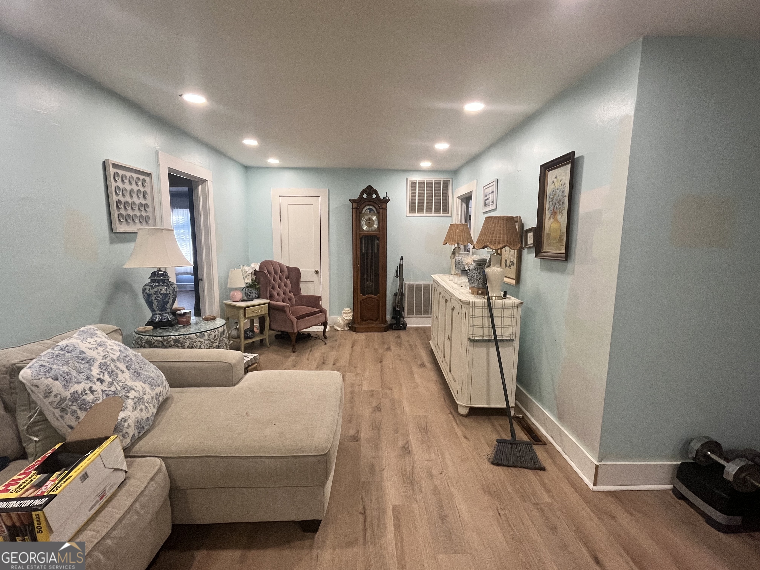 109 Schaefer Court Toccoa, GA 30577 - Photo 7 of 28 a living room with furniture and a wooden floor