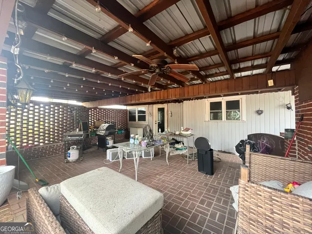 a outdoor space with lots of white furniture