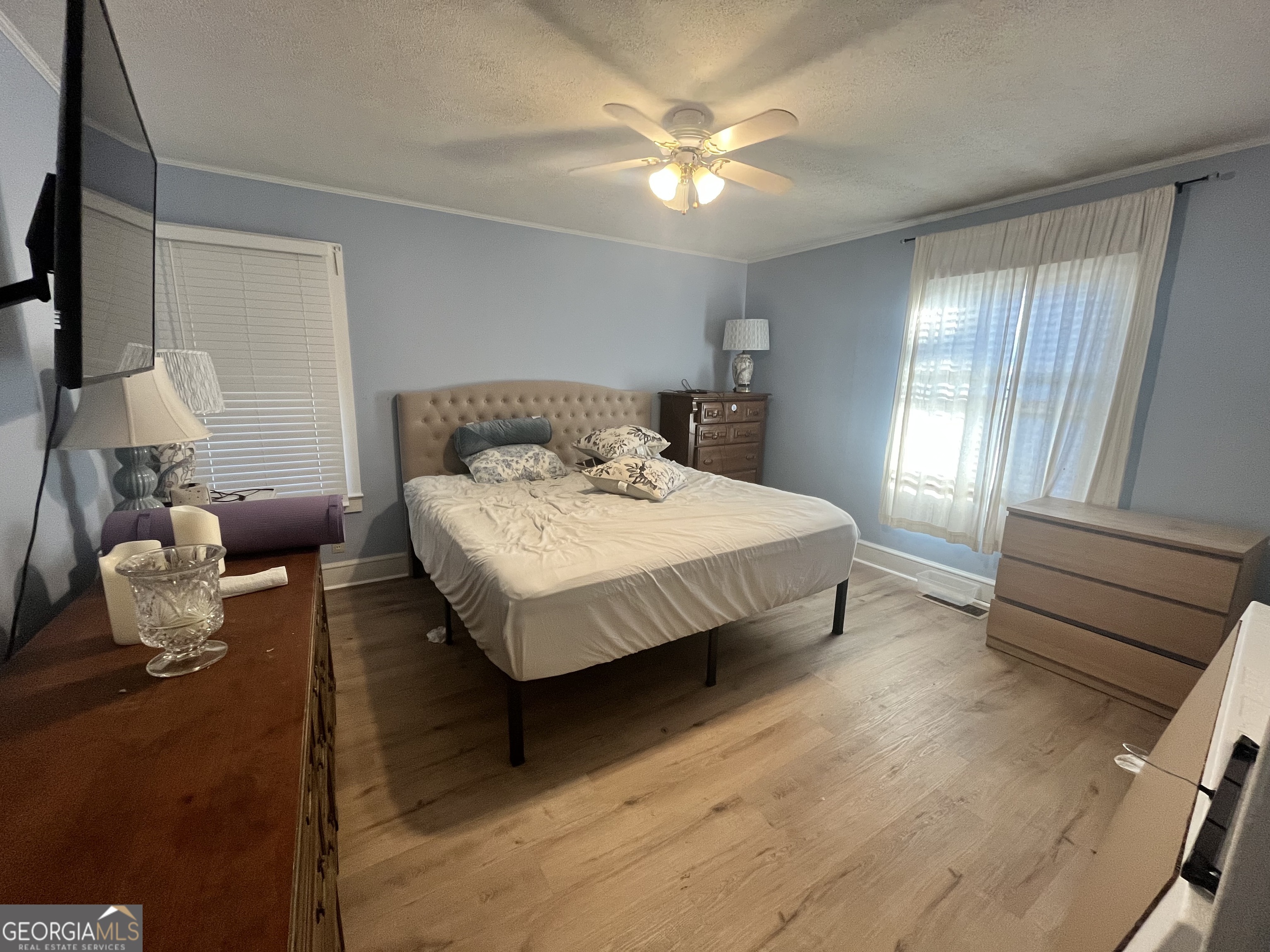 109 Schaefer Court Toccoa, GA 30577 - Photo 10 of 28 a bedroom with a bed and a chandelier