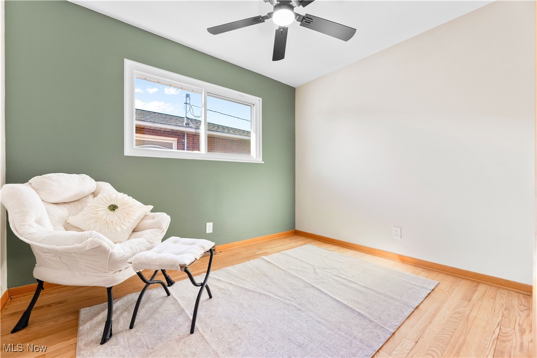 615 Ingalls Road Akron, OH 44312 - Photo 15 of 50 Living area featuring baseboards and wood finished floors