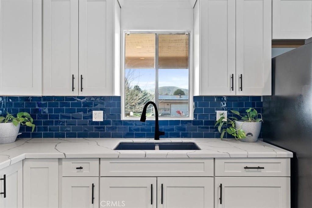 5405 Marjorie Street Weldon, CA 93283 - Photo 15 of 36 a kitchen with a sink and cabinets