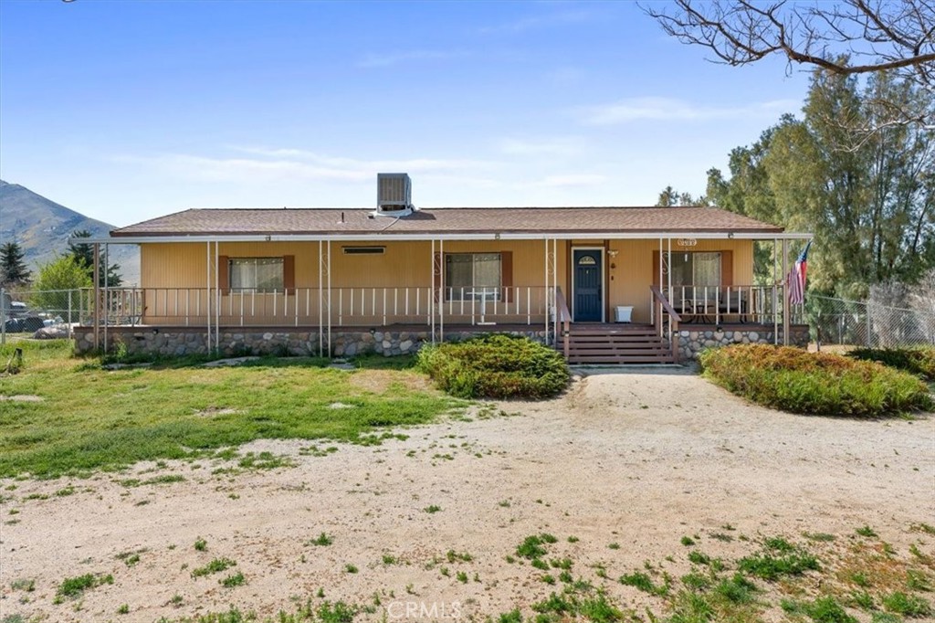 5405 Marjorie Street Weldon, CA 93283 - Photo 2 of 36 a front view of a house with a yard and potted plants