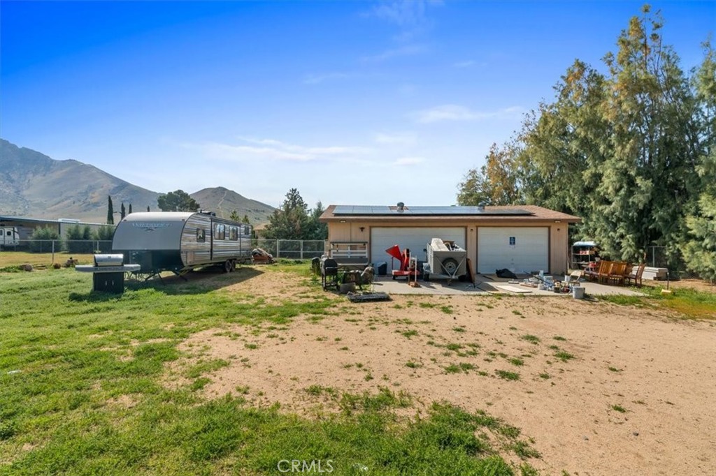 5405 Marjorie Street Weldon, CA 93283 - Photo 23 of 36 a view of house with yard and car parked