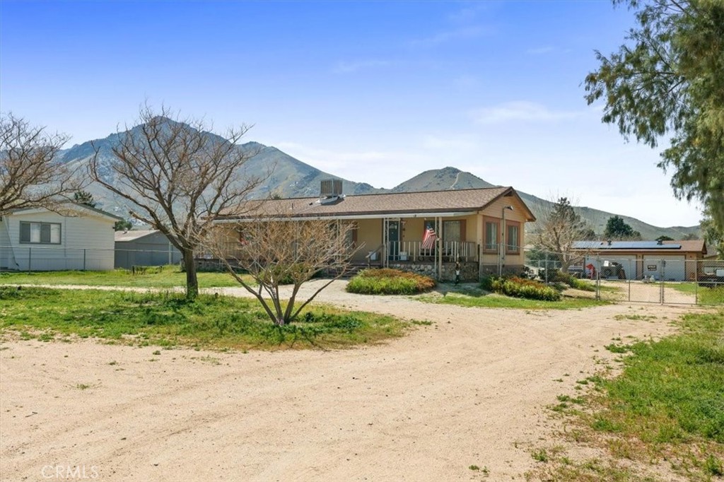 5405 Marjorie Street Weldon, CA 93283 - Photo 3 of 36 a front view of a house with a yard and garage