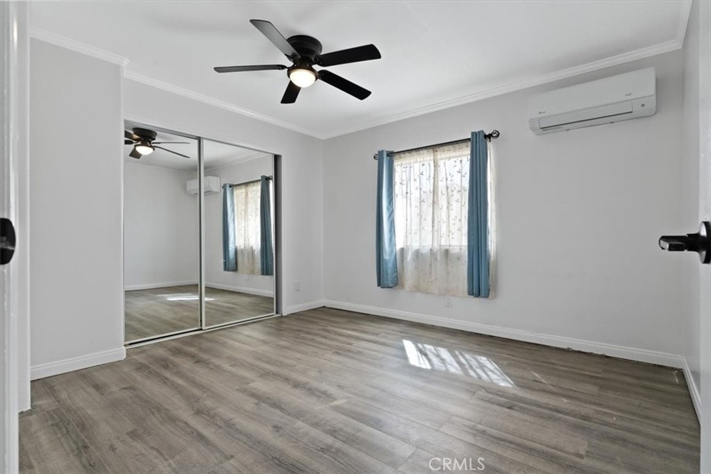 5405 Marjorie Street Weldon, CA 93283 - Photo 8 of 36 a view of an empty room with wooden floor and a window
