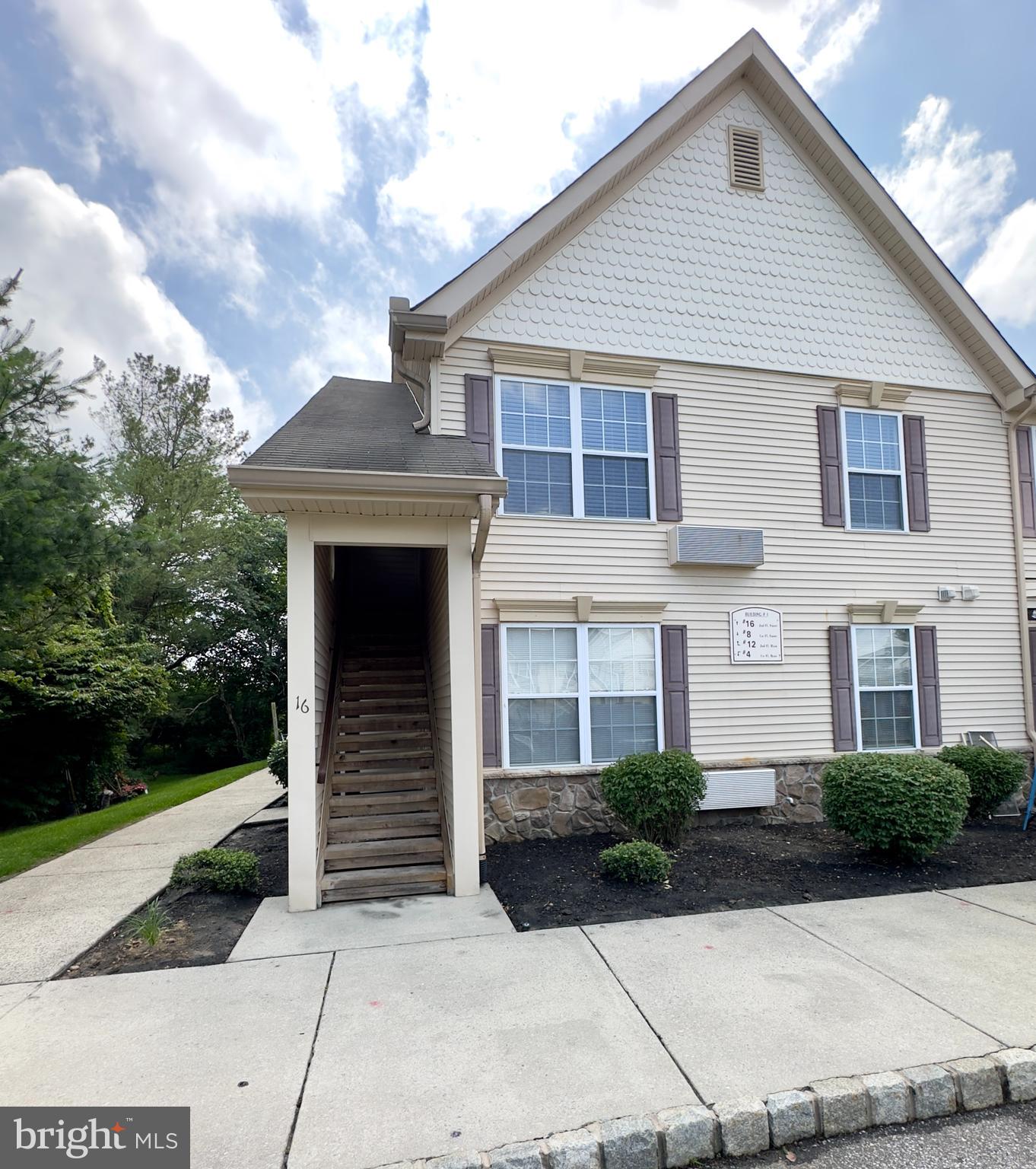 16 Sequoia Drive Berlin, NJ 08009 - Photo 15 of 16 a front view of a house with a garden