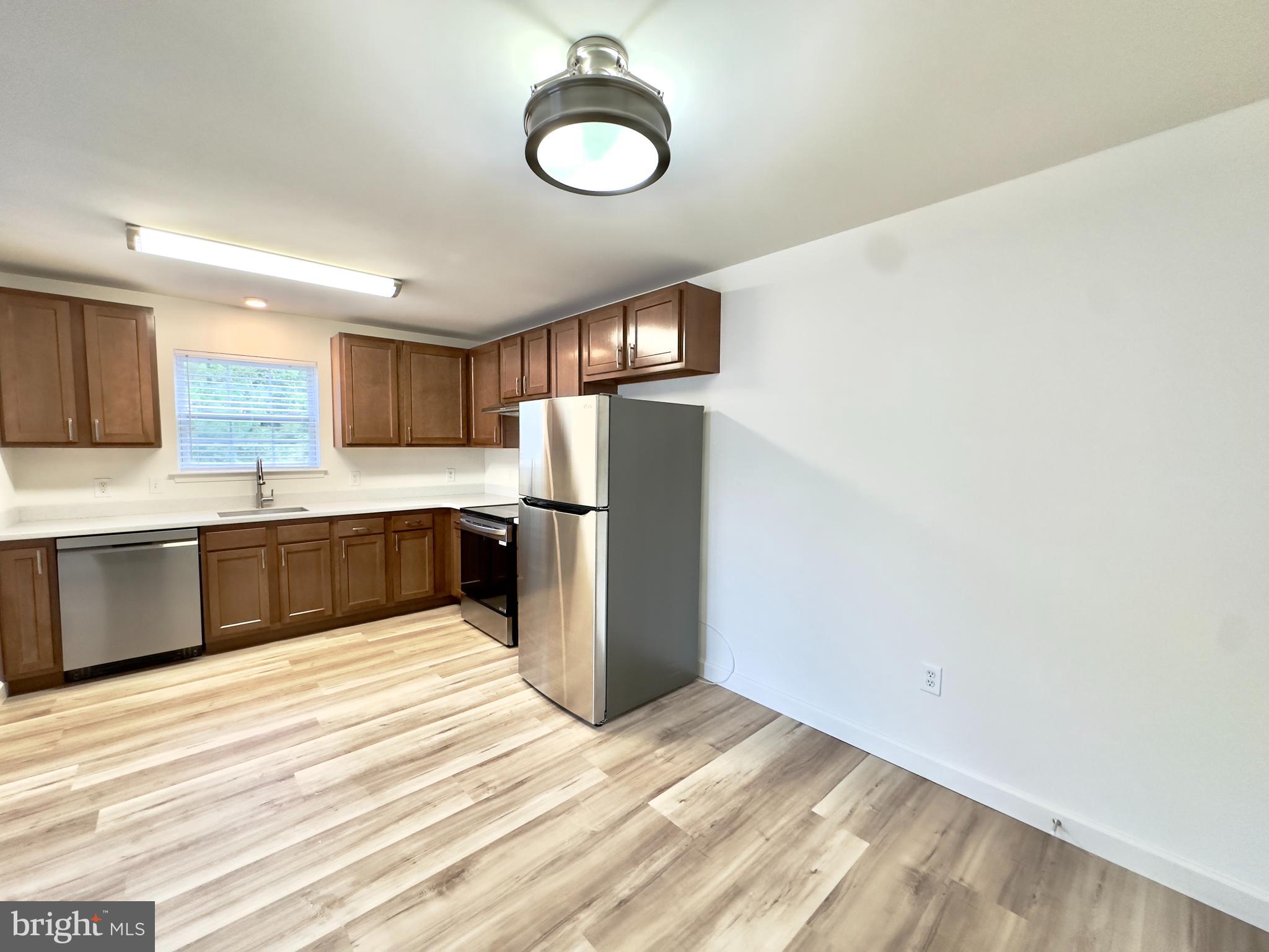 16 Sequoia Drive Berlin, NJ 08009 - Photo 5 of 16 a kitchen with stainless steel appliances granite countertop a refrigerator sink and stove