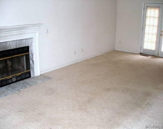 20007 Ivan Road Petersburg, VA 23803 - Photo 9 of 13 an empty room with windows and fireplace