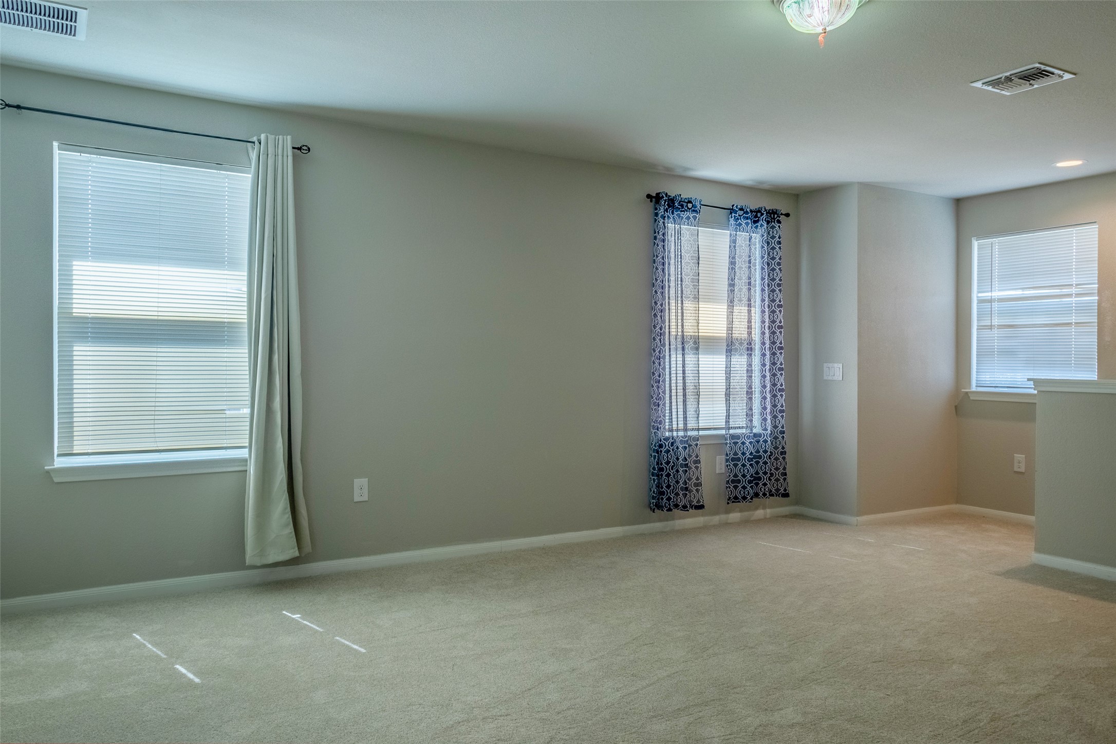7225 Ranchito Drive Austin, TX 78744 - Photo 23 of 39 A quiet living area provides a versatile space with ample natural light.
