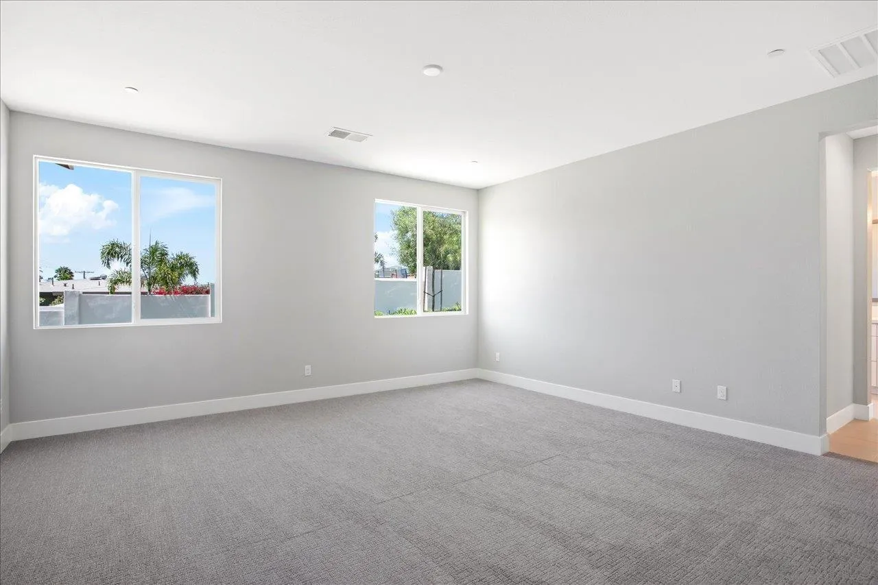 311 Brotherton Road Escondido, CA 92025 - Photo 20 of 33 an empty room with windows