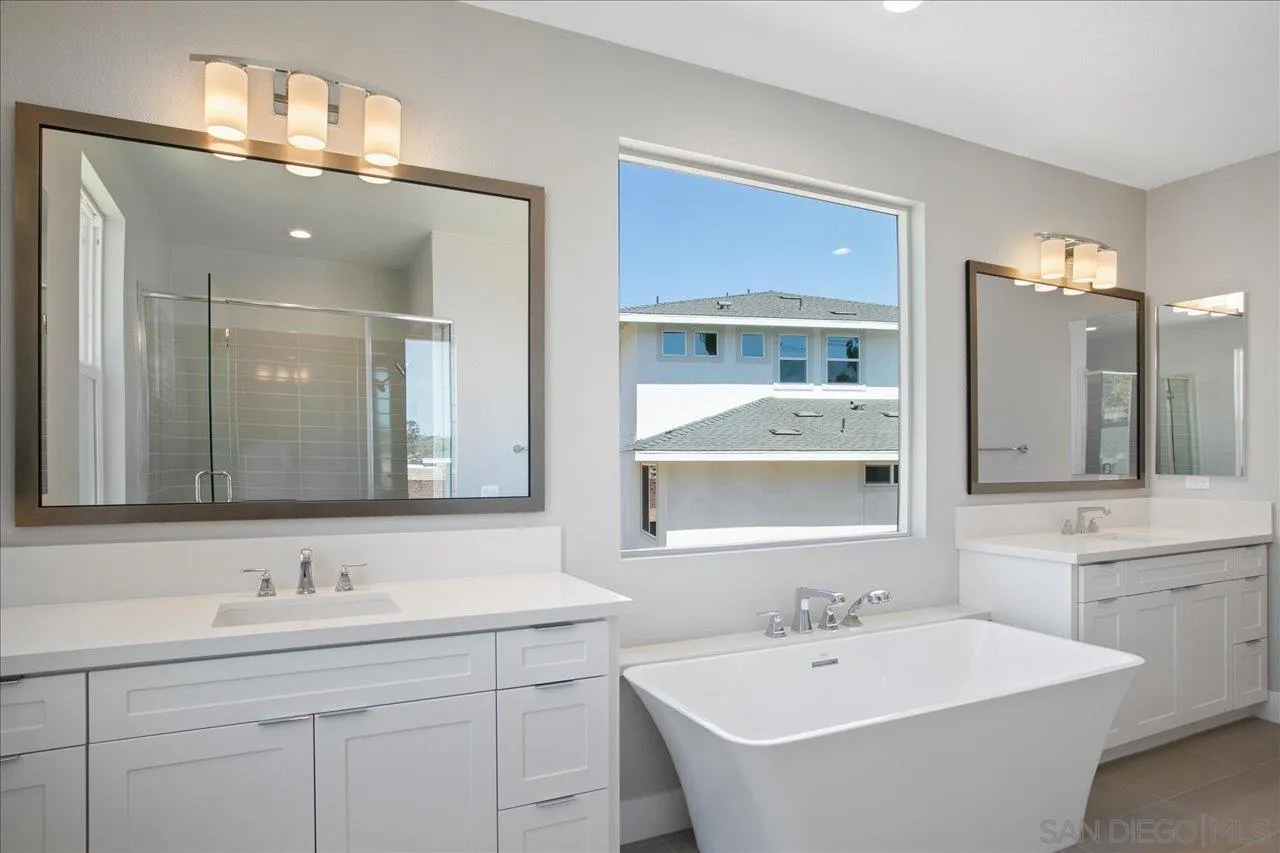 311 Brotherton Road Escondido, CA 92025 - Photo 23 of 33 a bathroom with a sink double vanity and a mirror