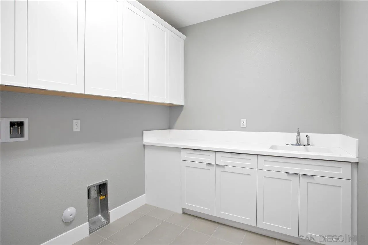 311 Brotherton Road Escondido, CA 92025 - Photo 25 of 33 a bathroom with a sink and vanity