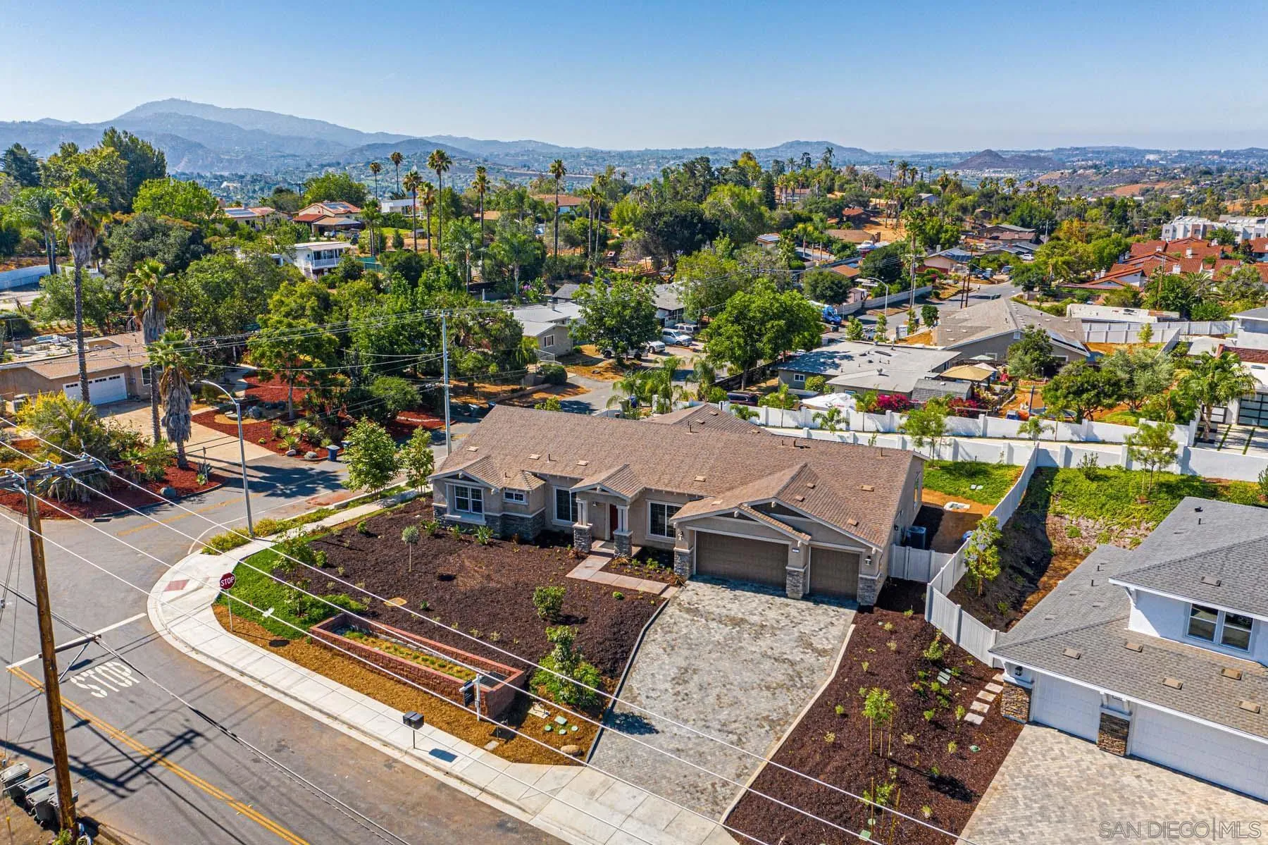 311 Brotherton Road Escondido, CA 92025 - Photo 27 of 33 an aerial view of a house with a swimming pool patio and mountain view in back