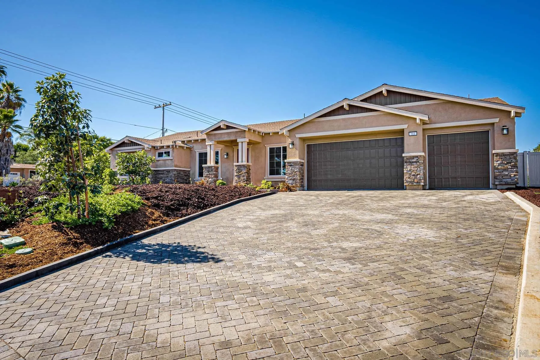 311 Brotherton Road Escondido, CA 92025 - Photo 31 of 33 a front view of a house with a yard and potted plants