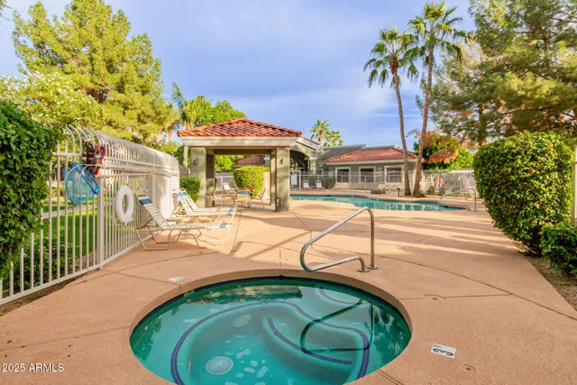 a view of a swimming pool with a patio
