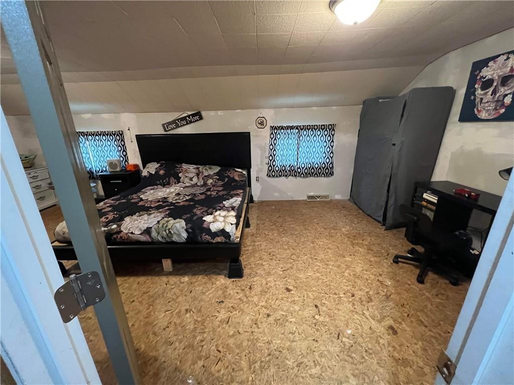 585 Lone Pine Road Washington, PA 15301 - Photo 16 of 22 a bed room with a bed chair and a fireplace