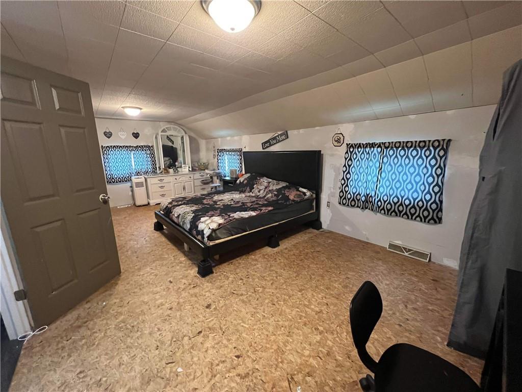 585 Lone Pine Road Washington, PA 15301 - Photo 19 of 22 a spacious bedroom with a bed and a large window