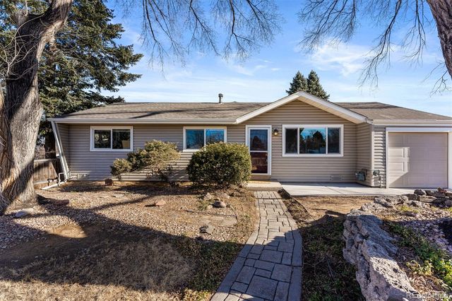 a front view of a house with yard