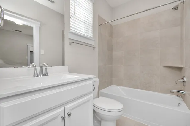 a bathroom with a sink a toilet and a bathtub