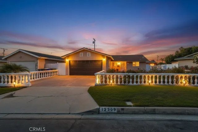 a view of a big yard in front of a house