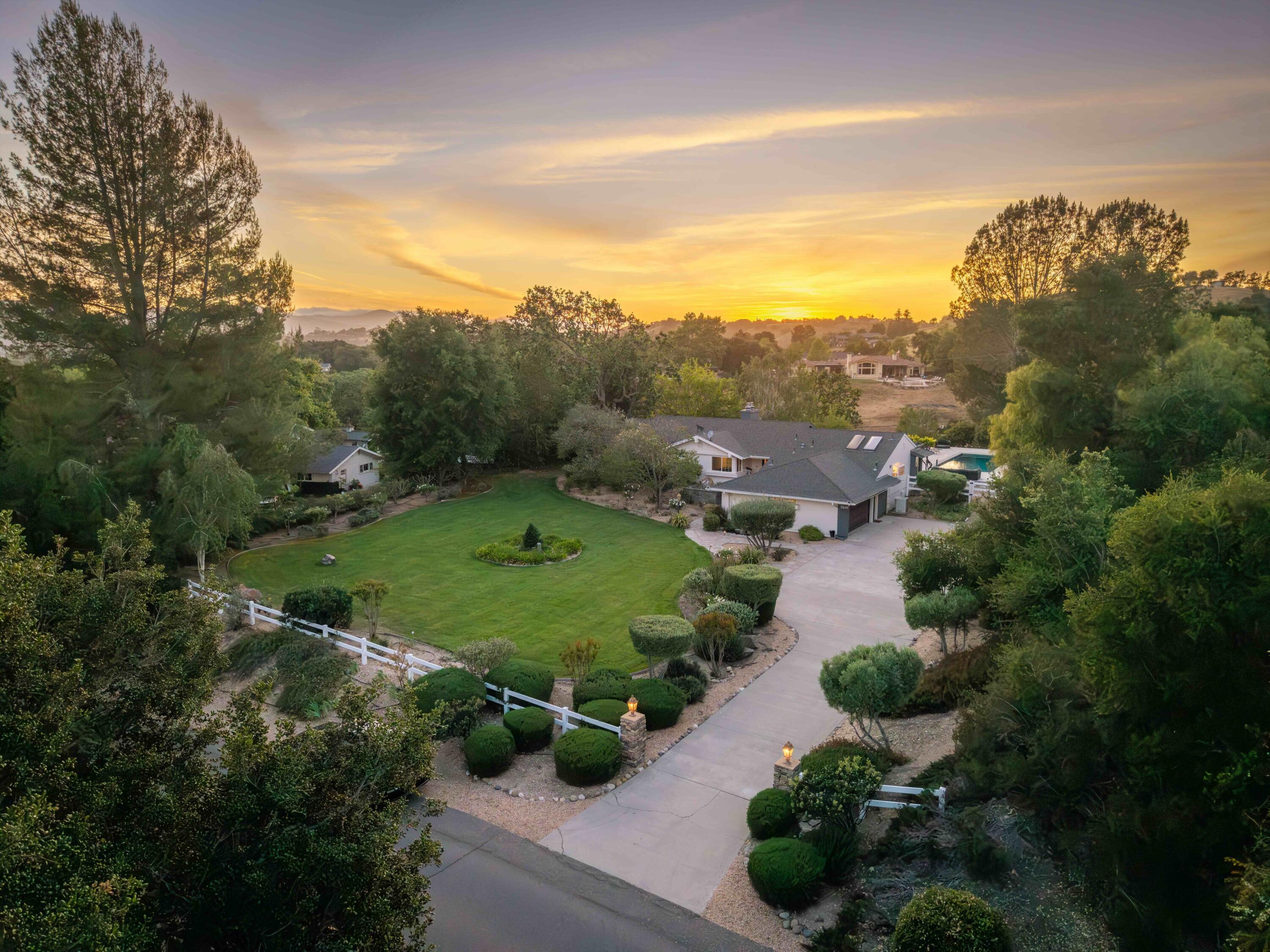 an aerial view of a golf course with parking space
