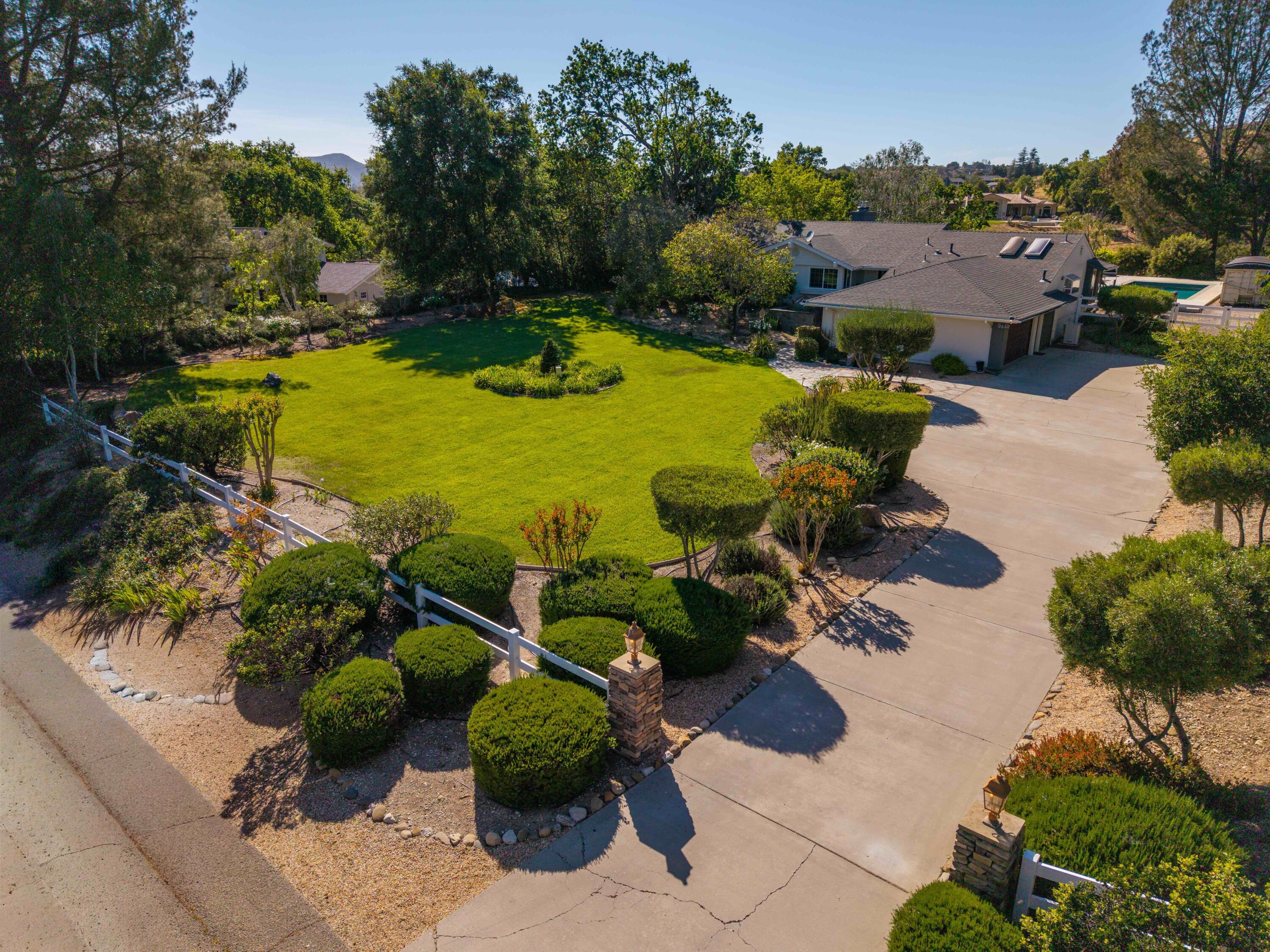 2667 Quail Valley Road Solvang, CA 93463 - Photo 16 of 62 an aerial view of a house with a garden and swimming pool