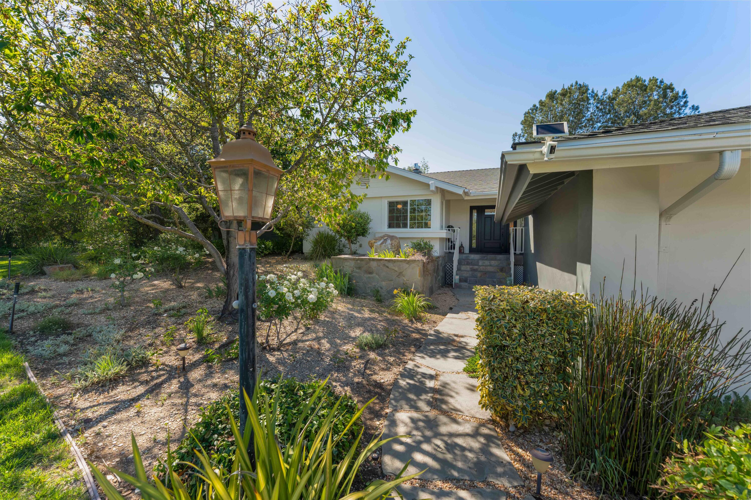 2667 Quail Valley Road Solvang, CA 93463 - Photo 18 of 62 a front view of a house with garden