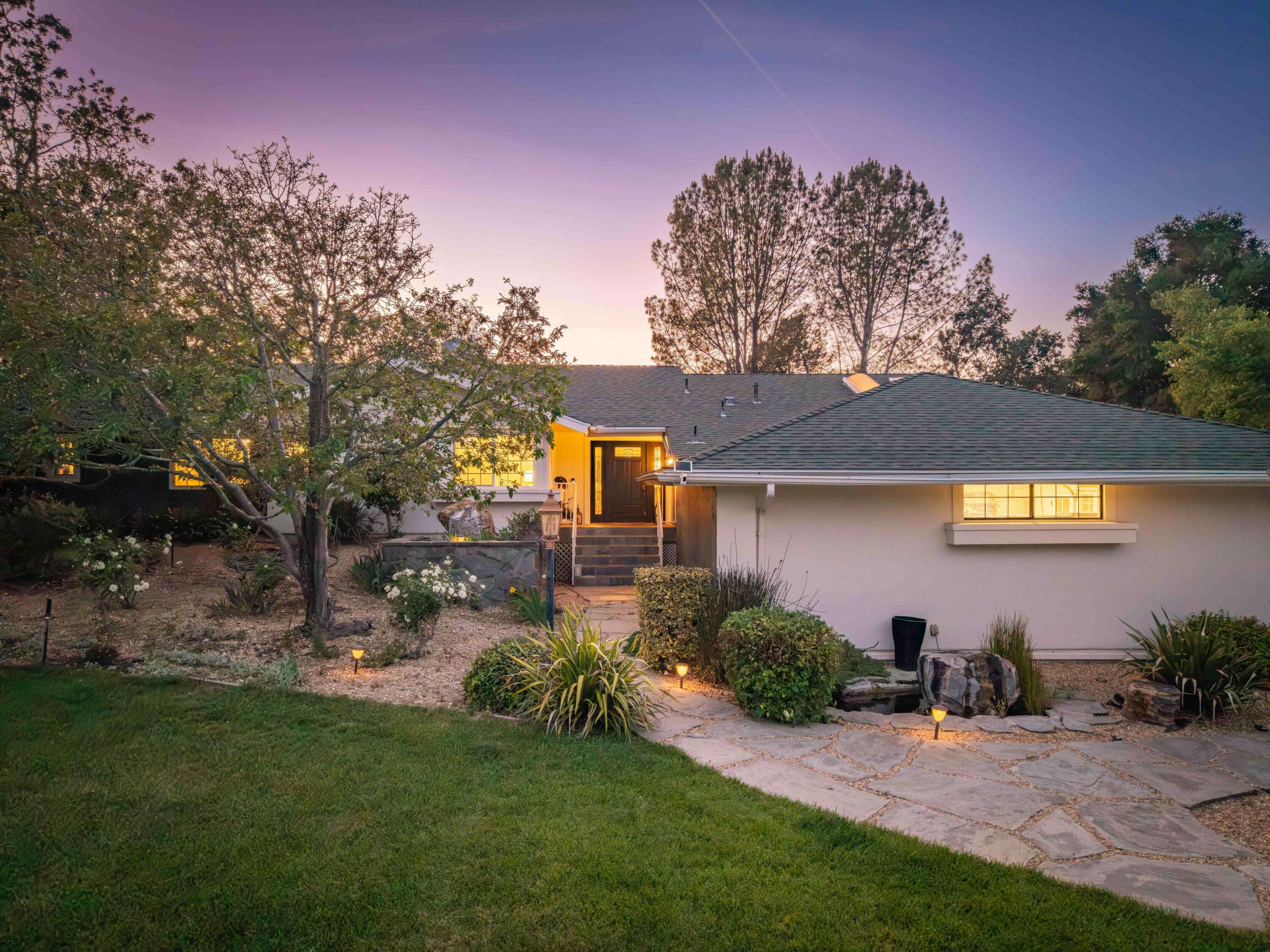 2667 Quail Valley Road Solvang, CA 93463 - Photo 2 of 62 a front view of a house with a yard and outdoor seating