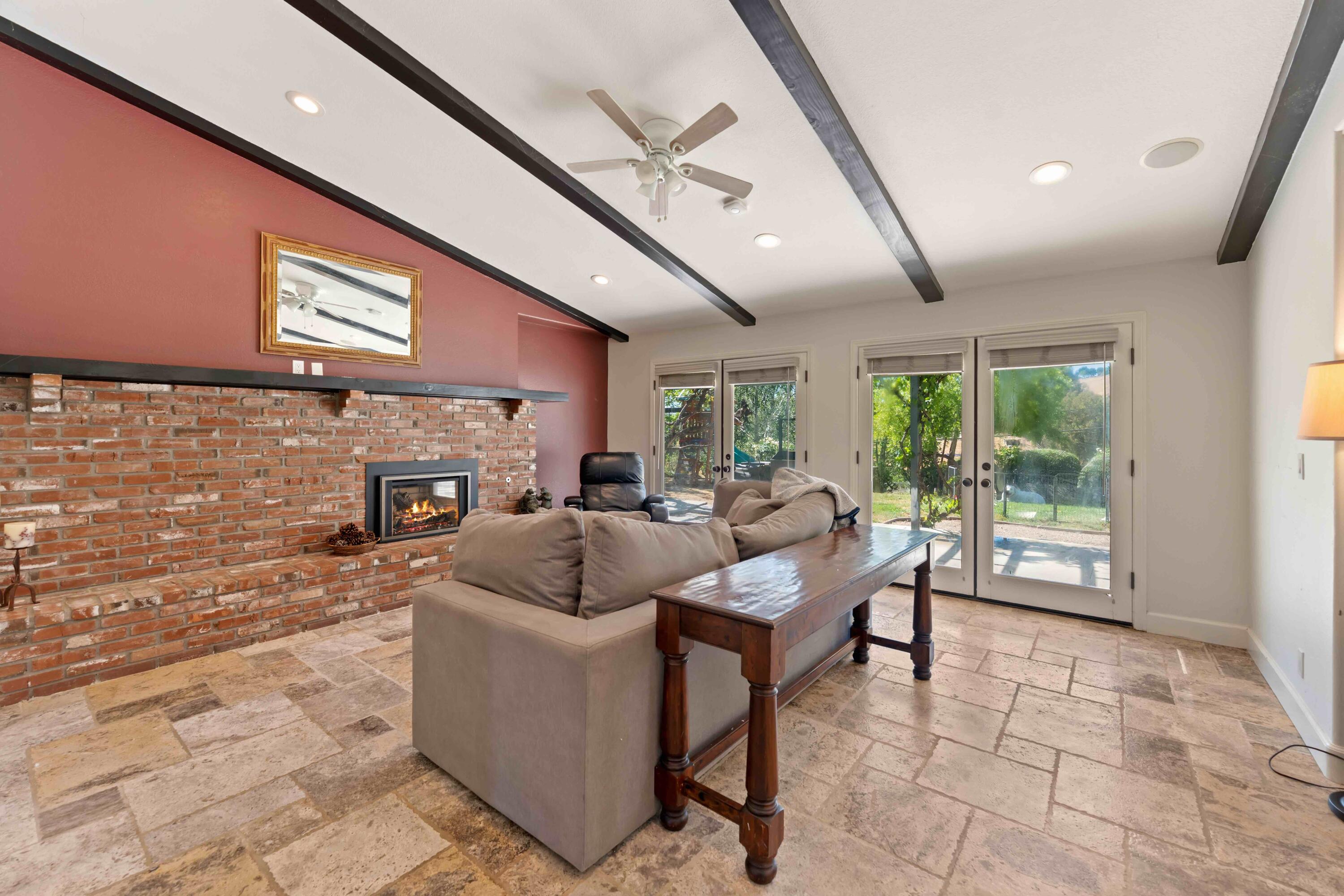 2667 Quail Valley Road Solvang, CA 93463 - Photo 22 of 62 a living room with fireplace furniture and a large window