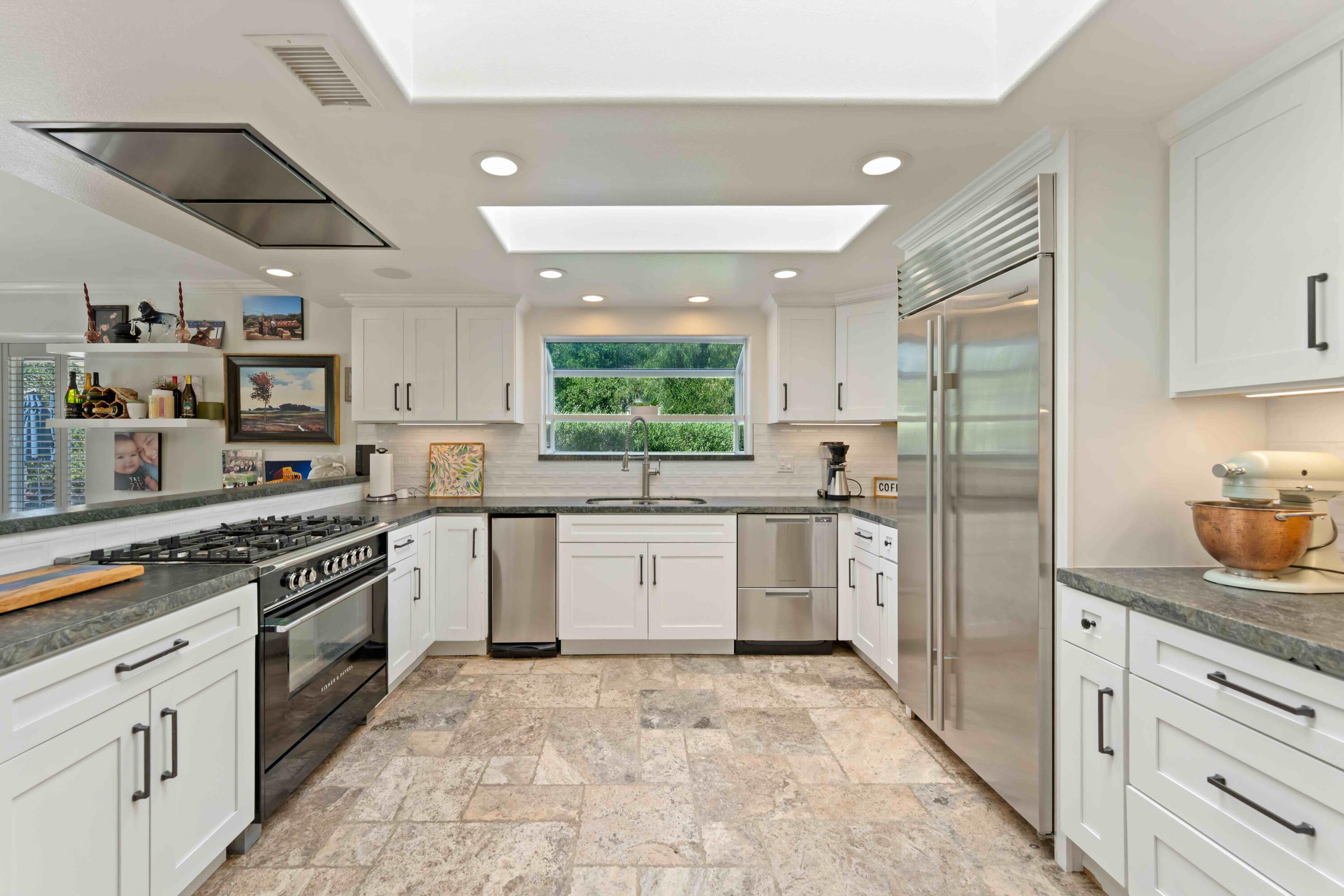 2667 Quail Valley Road Solvang, CA 93463 - Photo 27 of 62 a kitchen with a sink stove and refrigerator