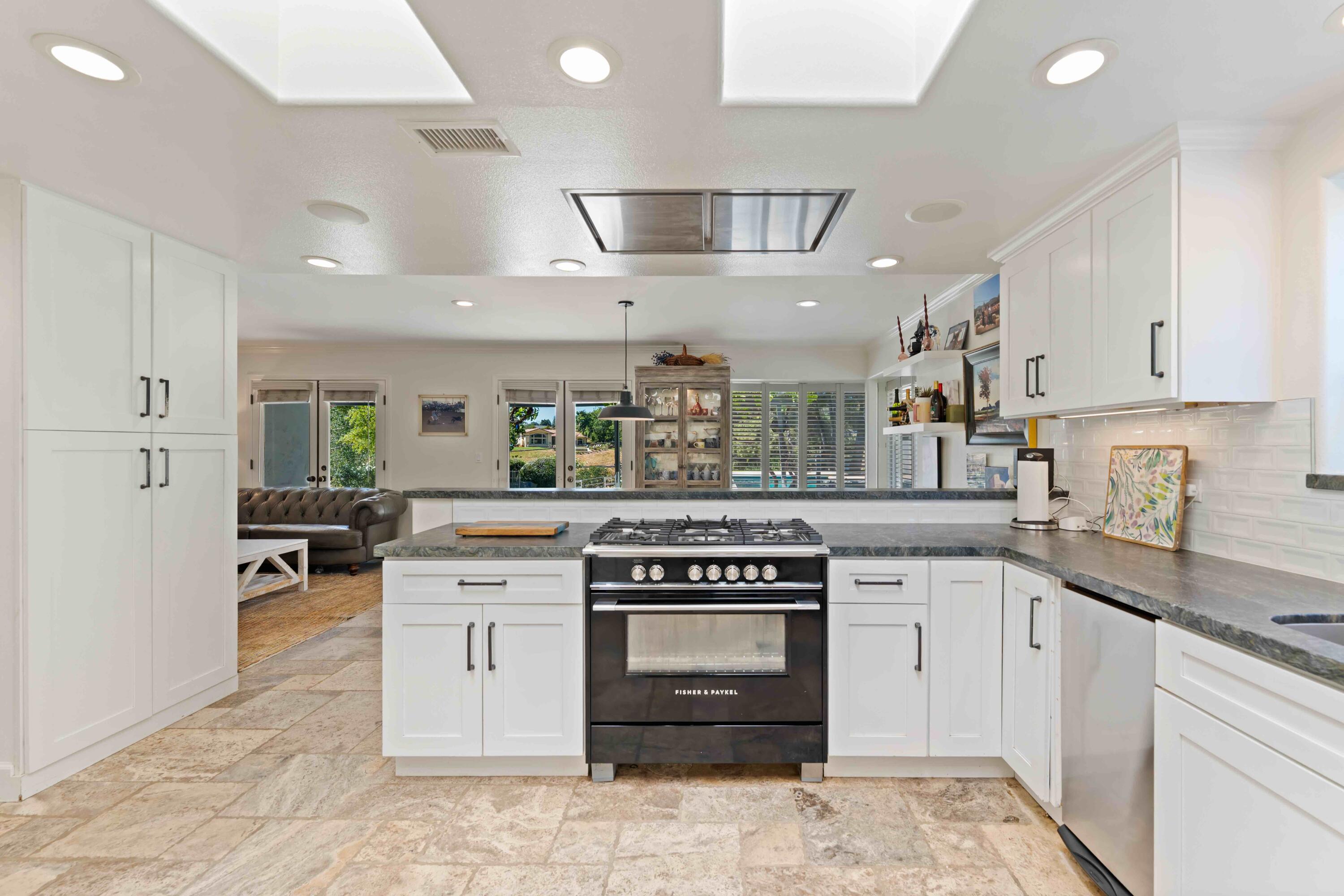2667 Quail Valley Road Solvang, CA 93463 - Photo 28 of 62 a kitchen with a stove top oven sink and cabinets