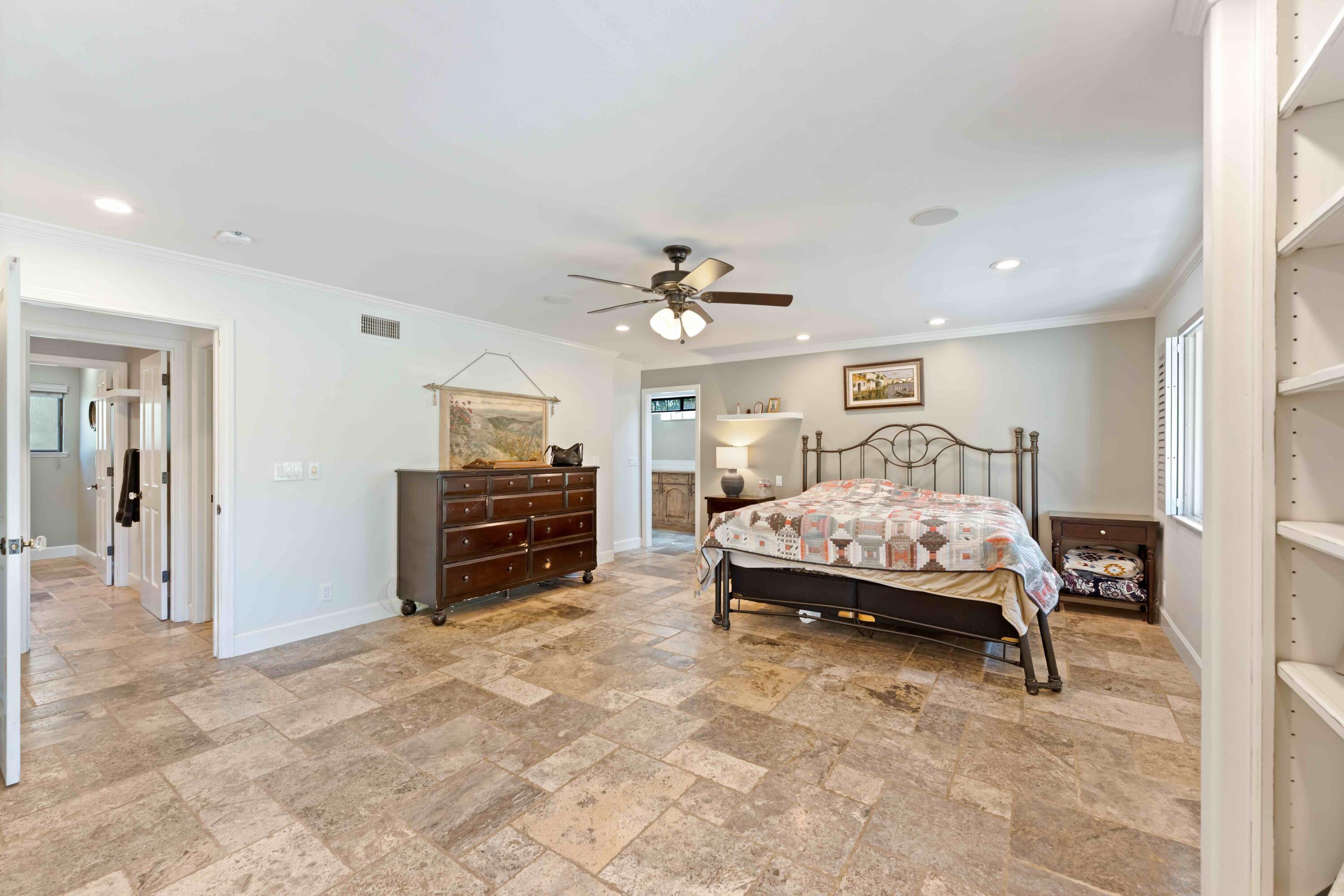 2667 Quail Valley Road Solvang, CA 93463 - Photo 38 of 62 a spacious bedroom with a bed and a television in it