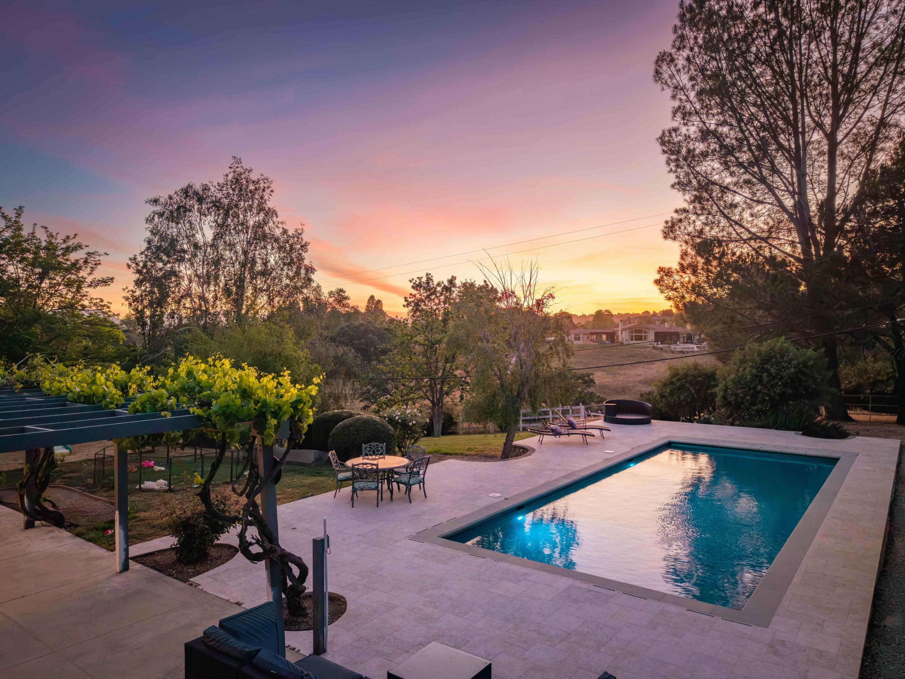2667 Quail Valley Road Solvang, CA 93463 - Photo 4 of 62 a view of a swimming pool with a patio and a yard
