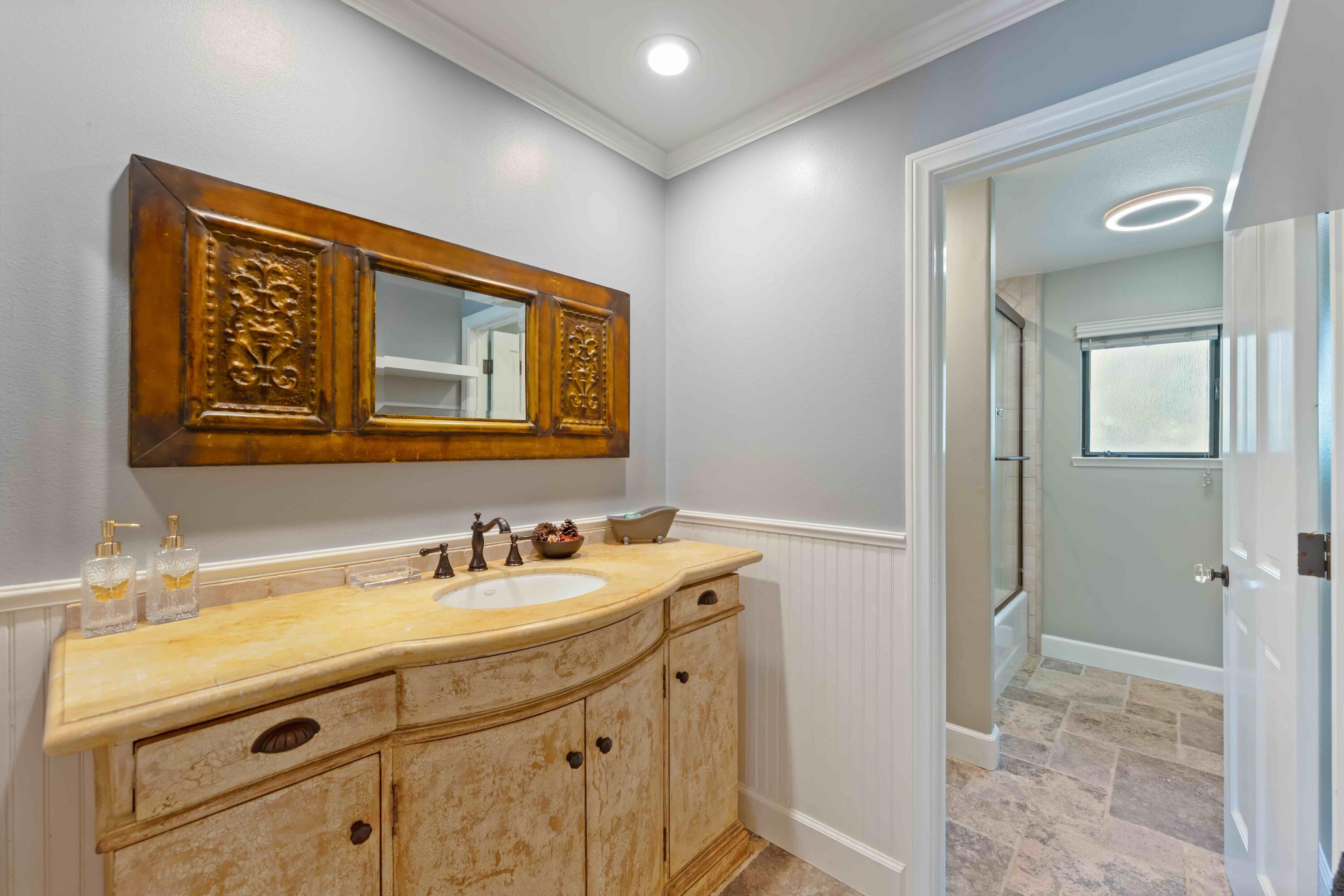 2667 Quail Valley Road Solvang, CA 93463 - Photo 42 of 62 a bathroom with a sink and a mirror