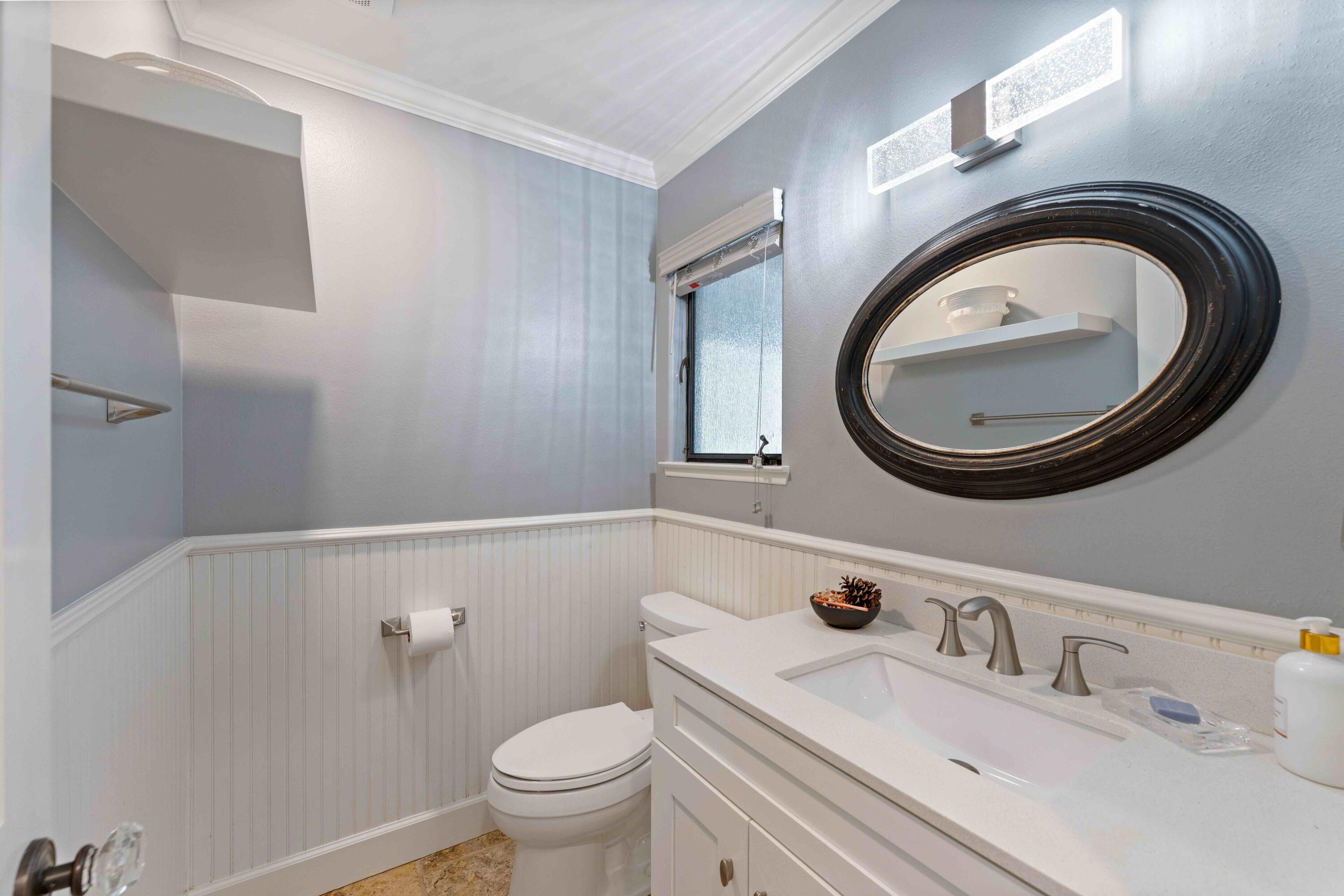 2667 Quail Valley Road Solvang, CA 93463 - Photo 44 of 62 a bathroom with a sink a toilet and a mirror