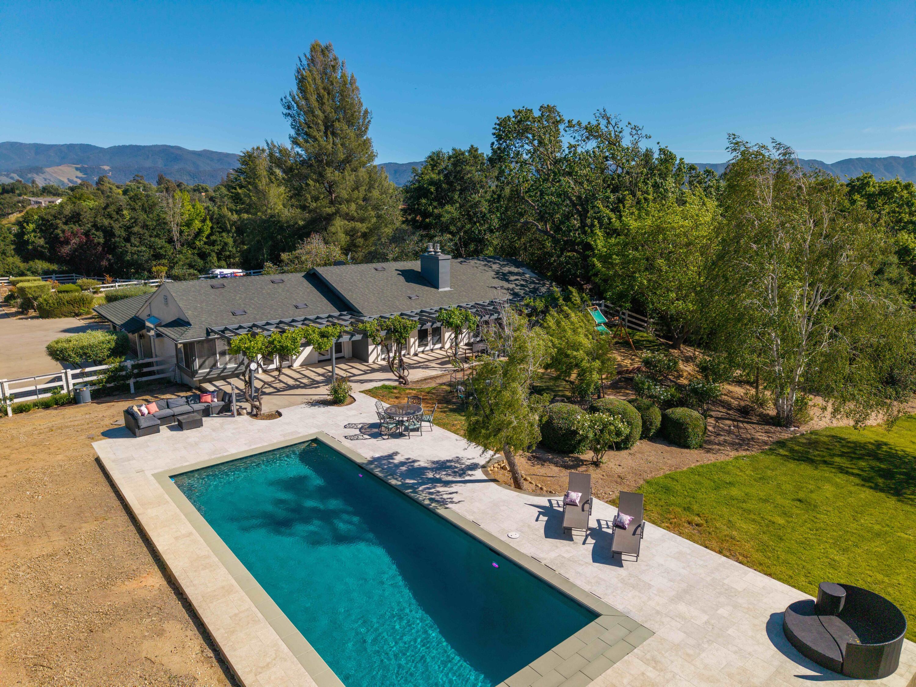 2667 Quail Valley Road Solvang, CA 93463 - Photo 50 of 62 a view of a swimming pool and lounge chairs